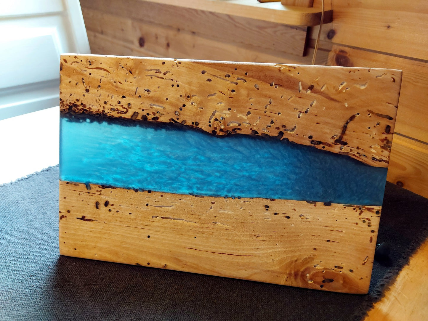 Wooden board in birch and blue epoxy