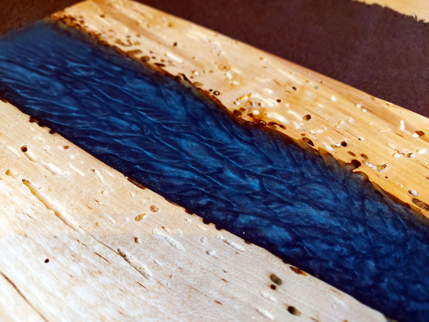 Wooden board in birch and blue epoxy